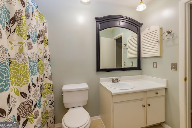 bathroom with toilet and vanity