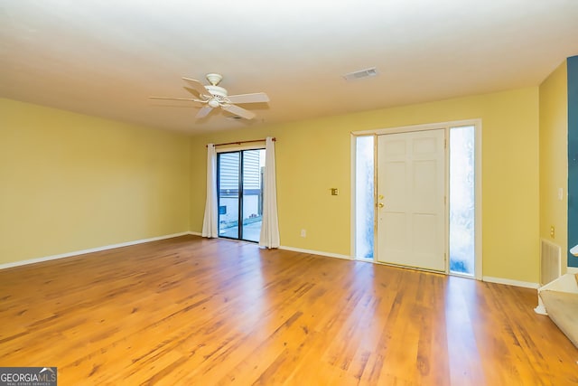 foyer featuring ceiling fan and wood-type flooring