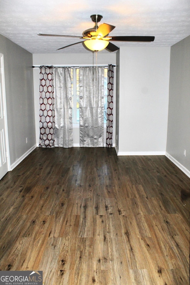 unfurnished room with a textured ceiling, ceiling fan, and wood-type flooring