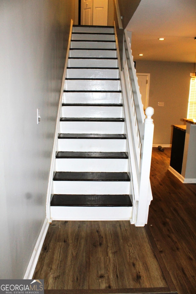 stairway with wood-type flooring