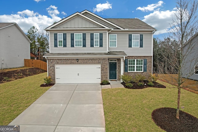 view of front of home with a front lawn and a garage