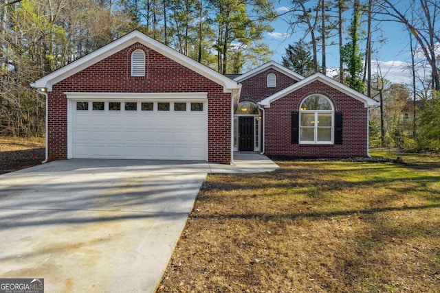 ranch-style home featuring a garage and a front lawn