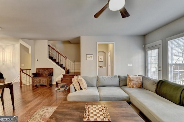 living room with ceiling fan and hardwood / wood-style flooring