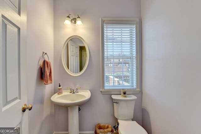 bathroom with toilet and sink