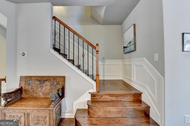 stairway featuring hardwood / wood-style flooring