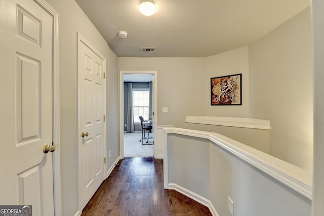 hall with dark hardwood / wood-style flooring