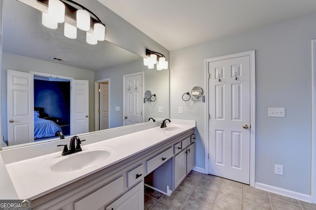 bathroom featuring tile patterned floors and vanity