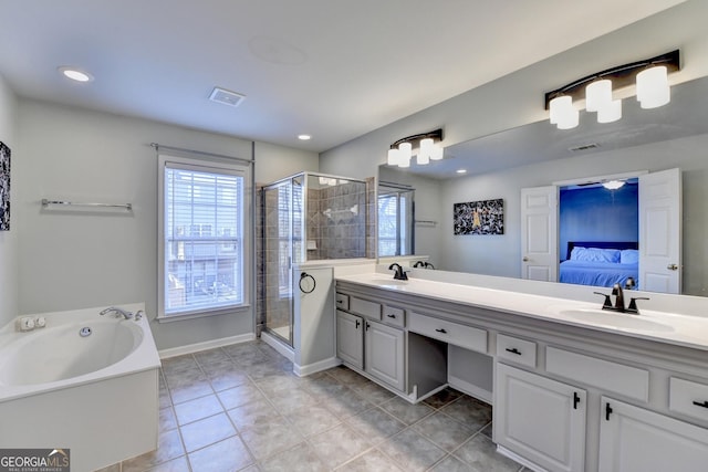 bathroom with vanity, tile patterned floors, and a shower with door