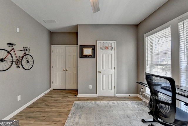 office space with hardwood / wood-style flooring