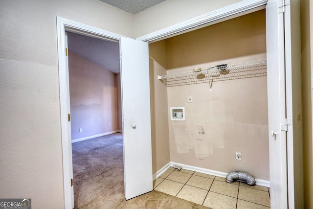 clothes washing area with washer hookup, light tile patterned floors, and hookup for an electric dryer