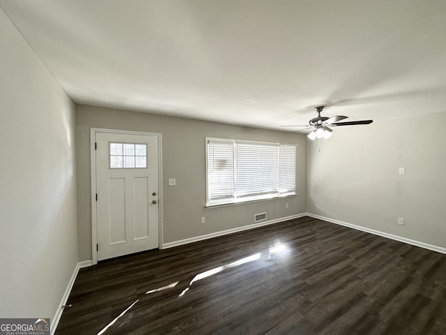 foyer entrance with ceiling fan and dark hardwood / wood-style flooring