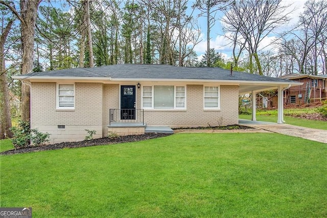 ranch-style home with a front lawn and a carport