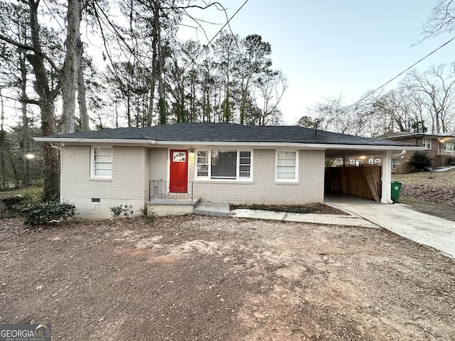 view of front of home featuring a carport