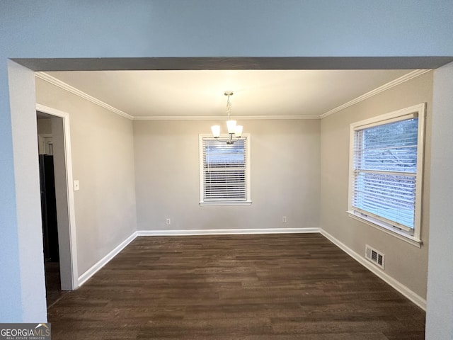 unfurnished dining area featuring dark hardwood / wood-style floors, a chandelier, and ornamental molding