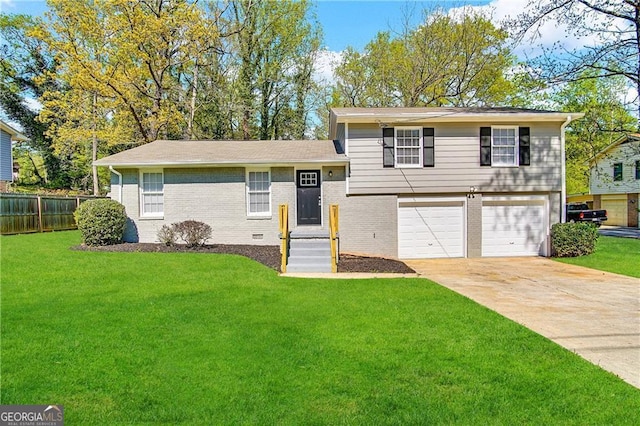 tri-level home with a front yard and a garage