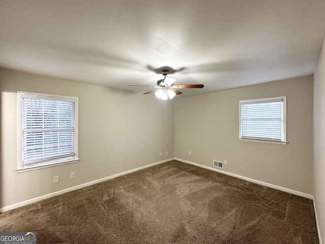 carpeted empty room with ceiling fan