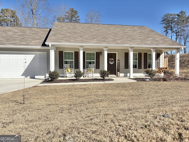 ranch-style house with a front yard, a porch, and a garage