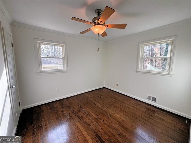 unfurnished room featuring ceiling fan, dark hardwood / wood-style flooring, and crown molding