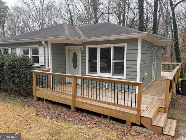 view of front facade with a wooden deck