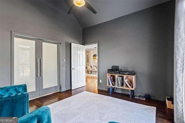 bedroom with ceiling fan, dark hardwood / wood-style flooring, french doors, and high vaulted ceiling