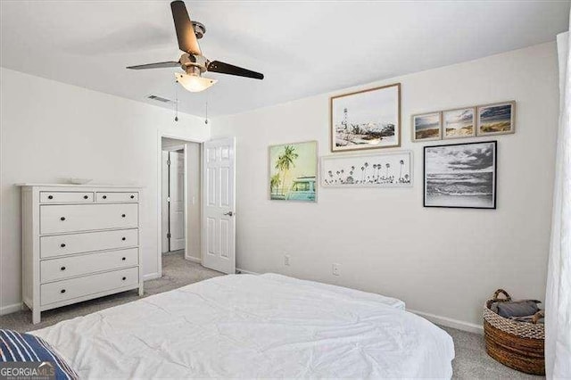 bedroom with ceiling fan and light colored carpet