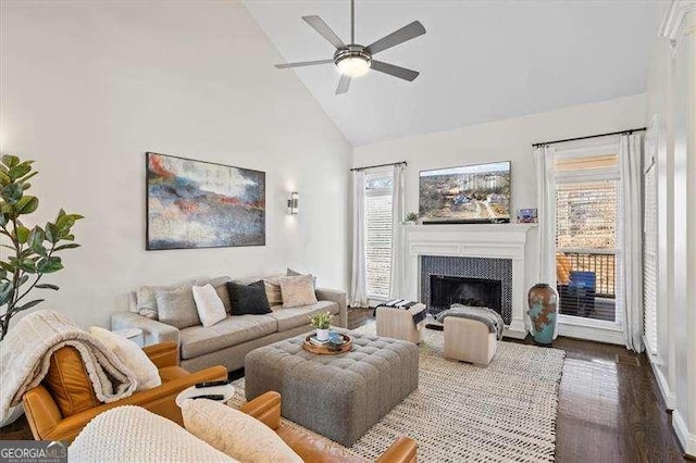 living room featuring high vaulted ceiling, dark wood-type flooring, and ceiling fan