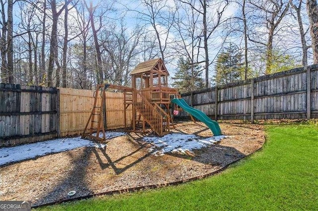 view of playground with a lawn