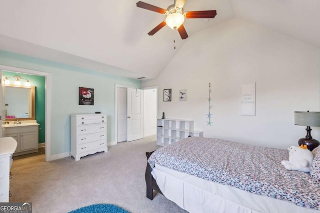 carpeted bedroom featuring ceiling fan, connected bathroom, and vaulted ceiling