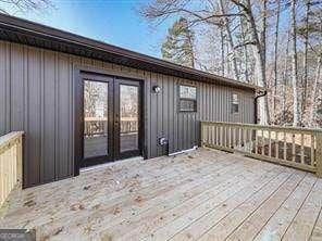 wooden deck featuring french doors