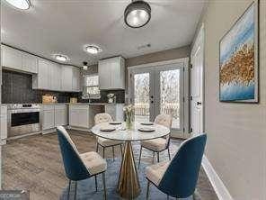 dining space with french doors and plenty of natural light