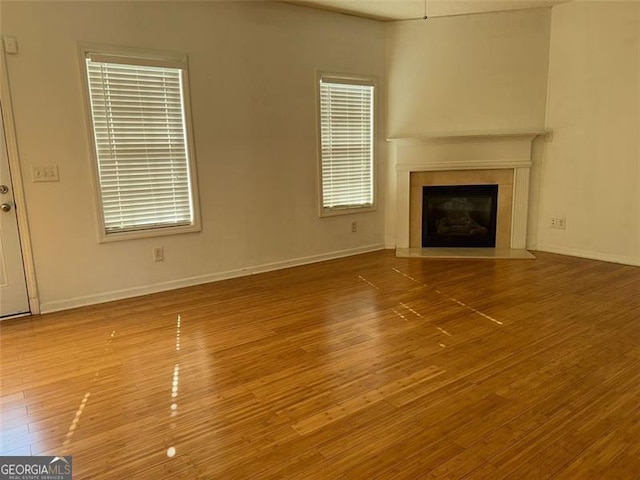 unfurnished living room featuring wood-type flooring