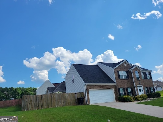 view of front of home with a garage and a front yard