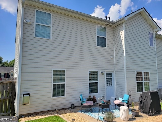 rear view of property featuring a patio