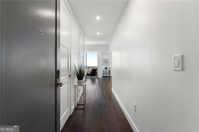 corridor featuring dark hardwood / wood-style floors