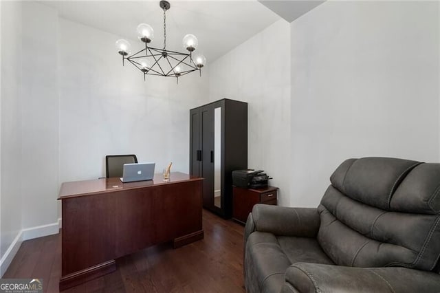 office area featuring dark hardwood / wood-style flooring and a notable chandelier