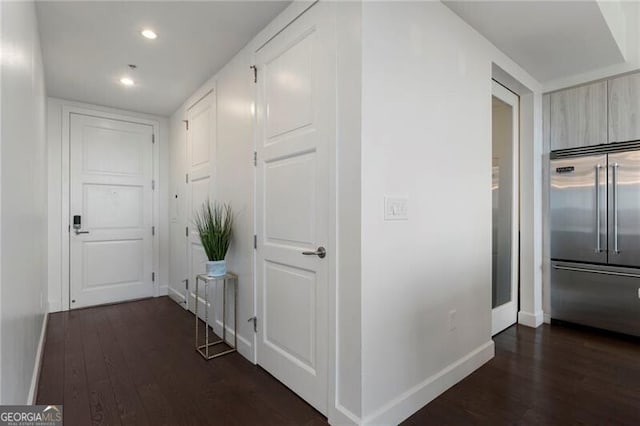 hall with dark wood-type flooring