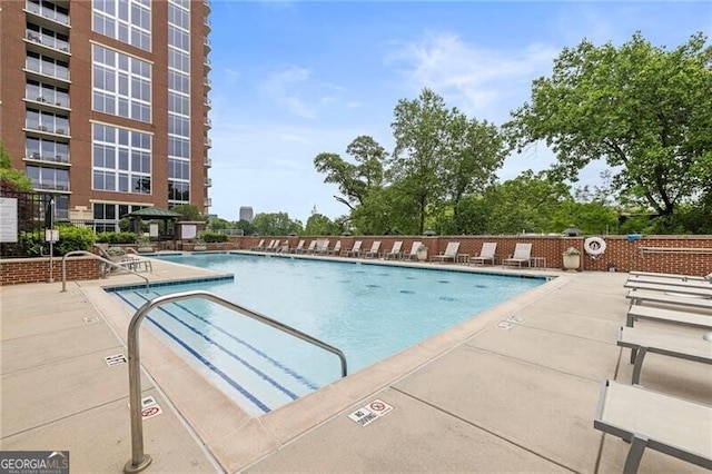 view of swimming pool featuring a patio