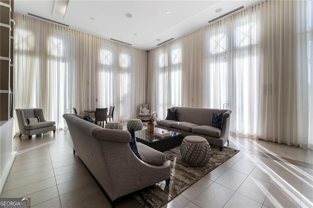 tiled living room featuring plenty of natural light