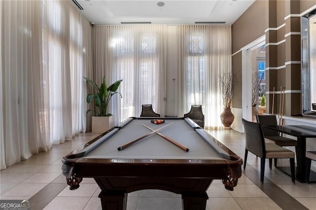 rec room with light tile patterned flooring, billiards, and a healthy amount of sunlight