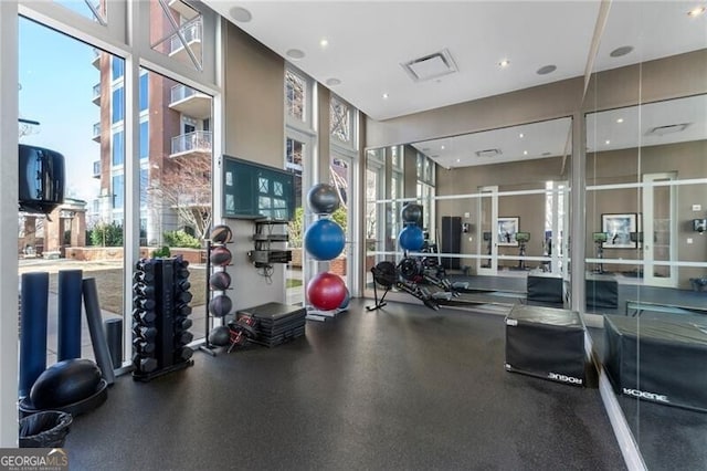 exercise room featuring expansive windows