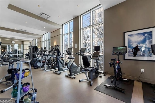 workout area featuring expansive windows