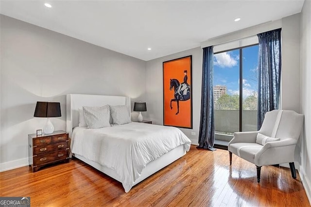 bedroom with wood-type flooring