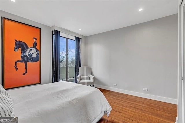 bedroom with wood-type flooring