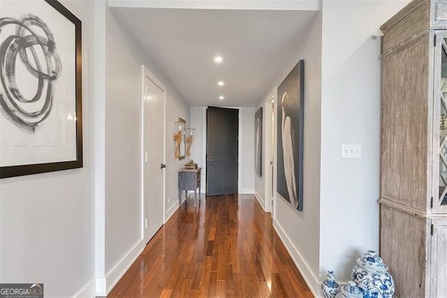 hallway featuring dark hardwood / wood-style flooring