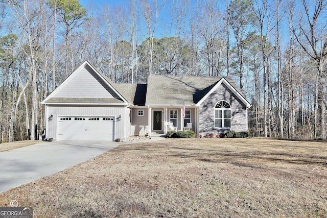 view of front of house featuring a garage and a front yard