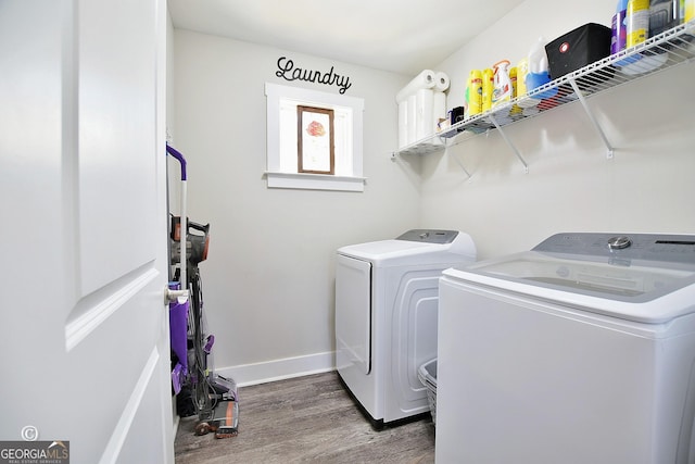 laundry area featuring dark hardwood / wood-style floors and separate washer and dryer