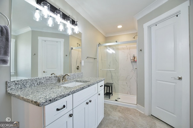 bathroom featuring vanity, crown molding, and a shower with shower door