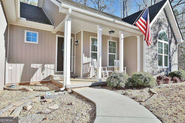 entrance to property featuring a porch