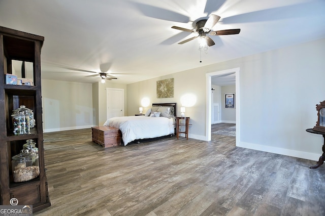 bedroom featuring dark wood-type flooring and ceiling fan