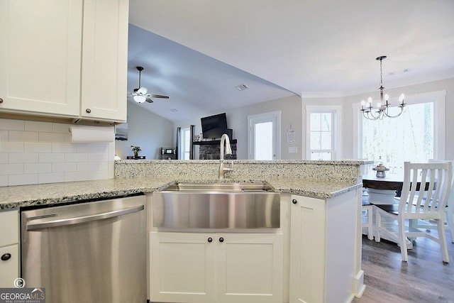 kitchen featuring white cabinetry, dishwasher, sink, and light stone countertops